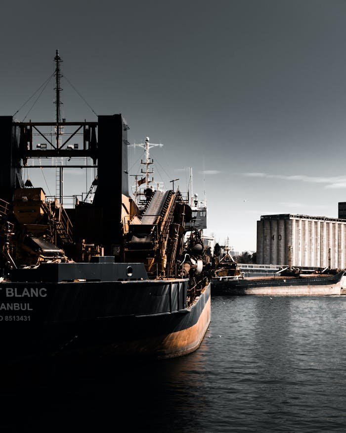 pexels-photo-16520011 Moody view of a cargo ship moored in Istanbul harbor under a dusky sky.