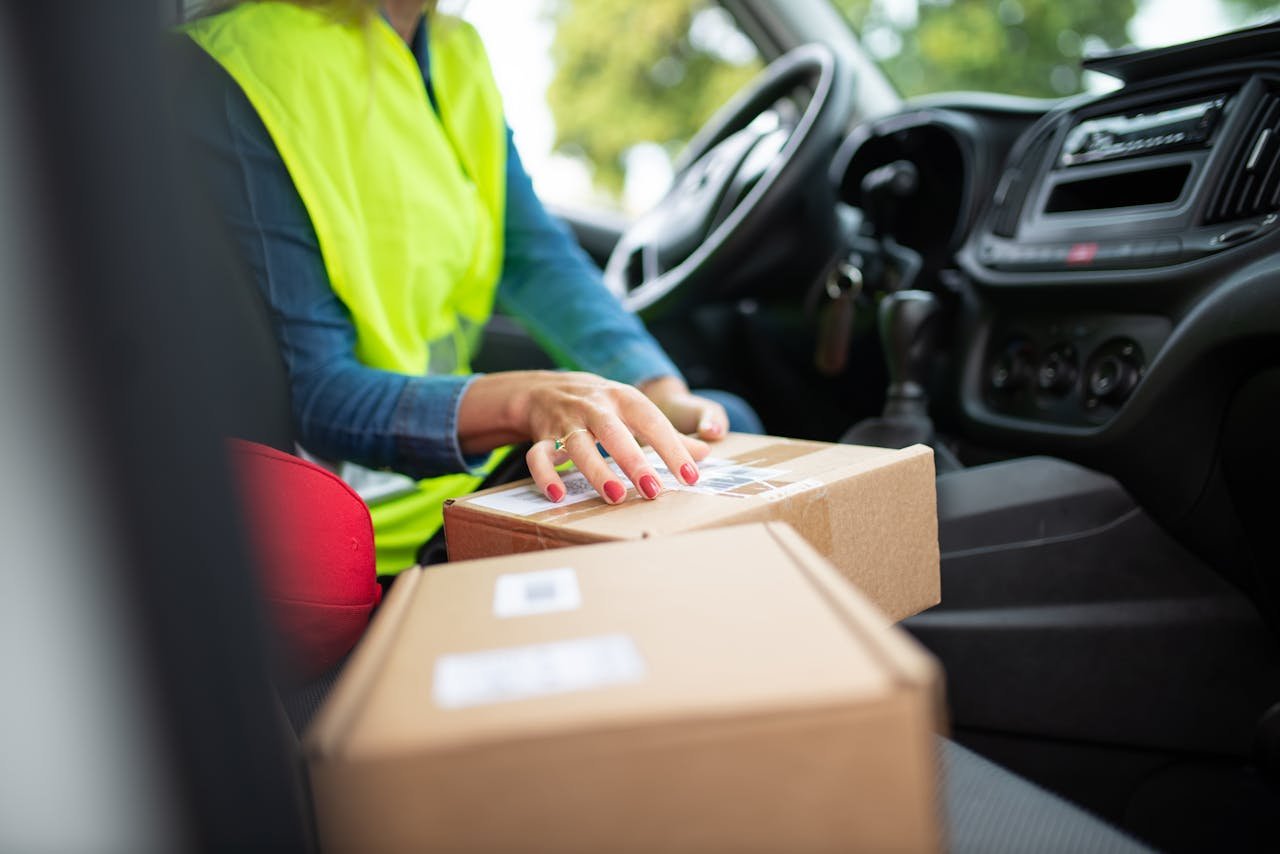 creative Courier organizing parcels inside a vehicle, highlighting the delivery process. Perfect for logistics themes.